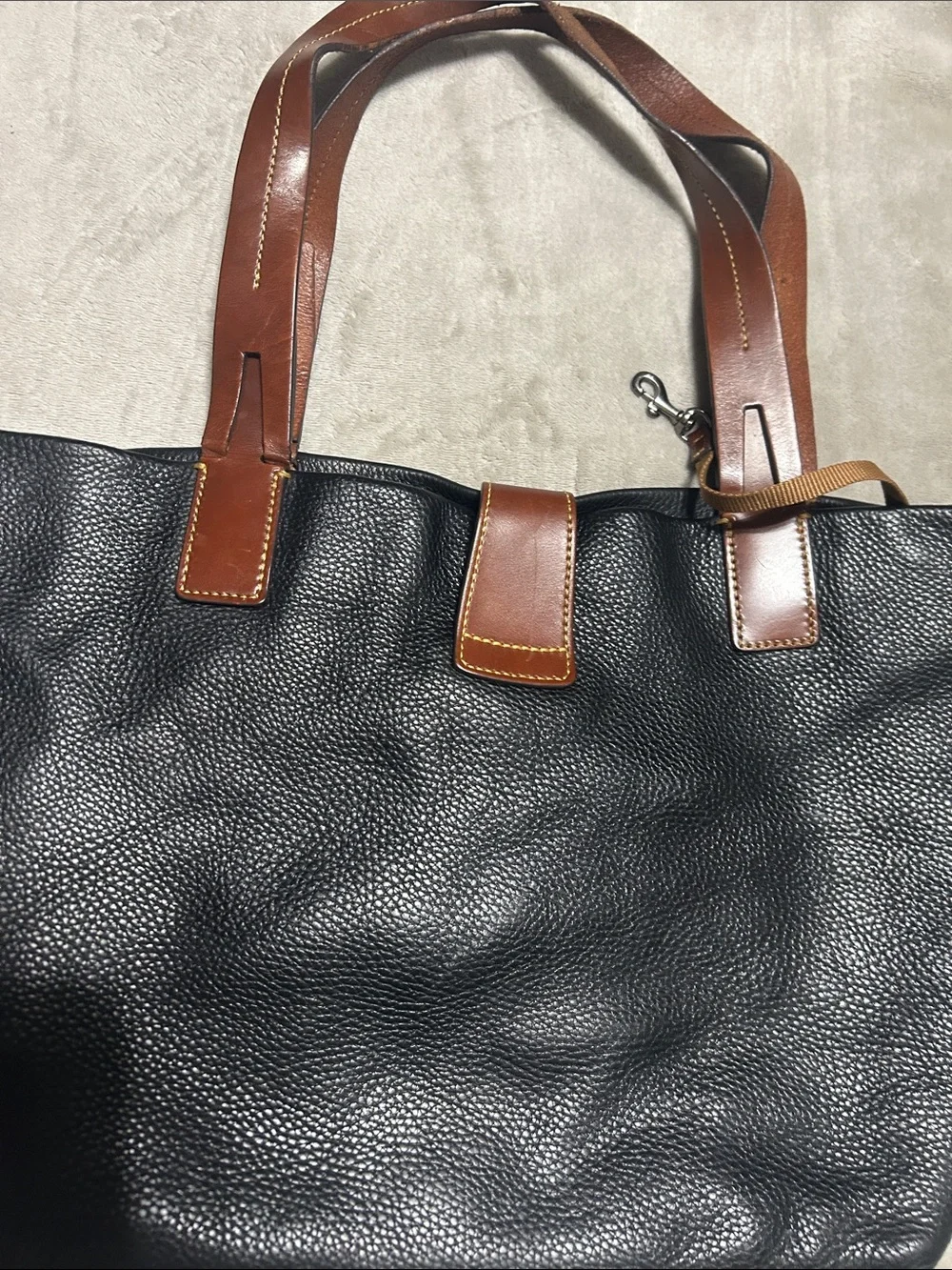 Dooney & Bourke Black Pebbled Leather Tote with Brown Trim and Gold Hardware